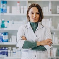 Young woman pharmacist at pharmacy